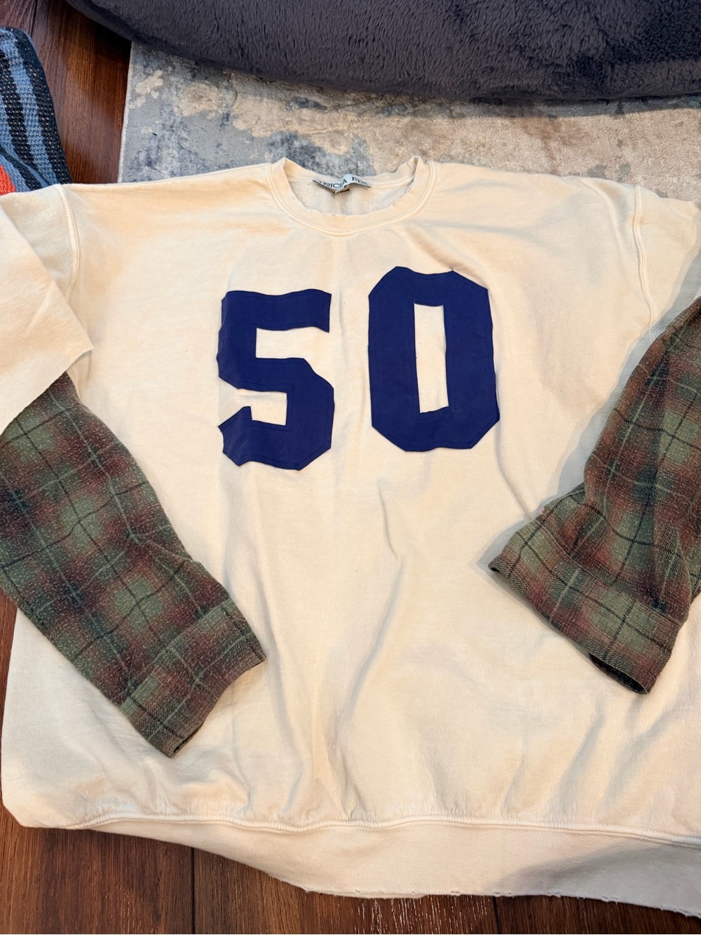 Tricia Fix Cream Sweatshirt with Blue '50' and Plaid Sleeves